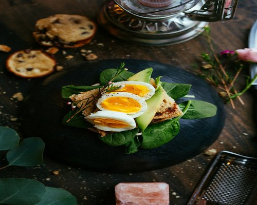 A healthy breakfast featuring boiled eggs and whole grain bread